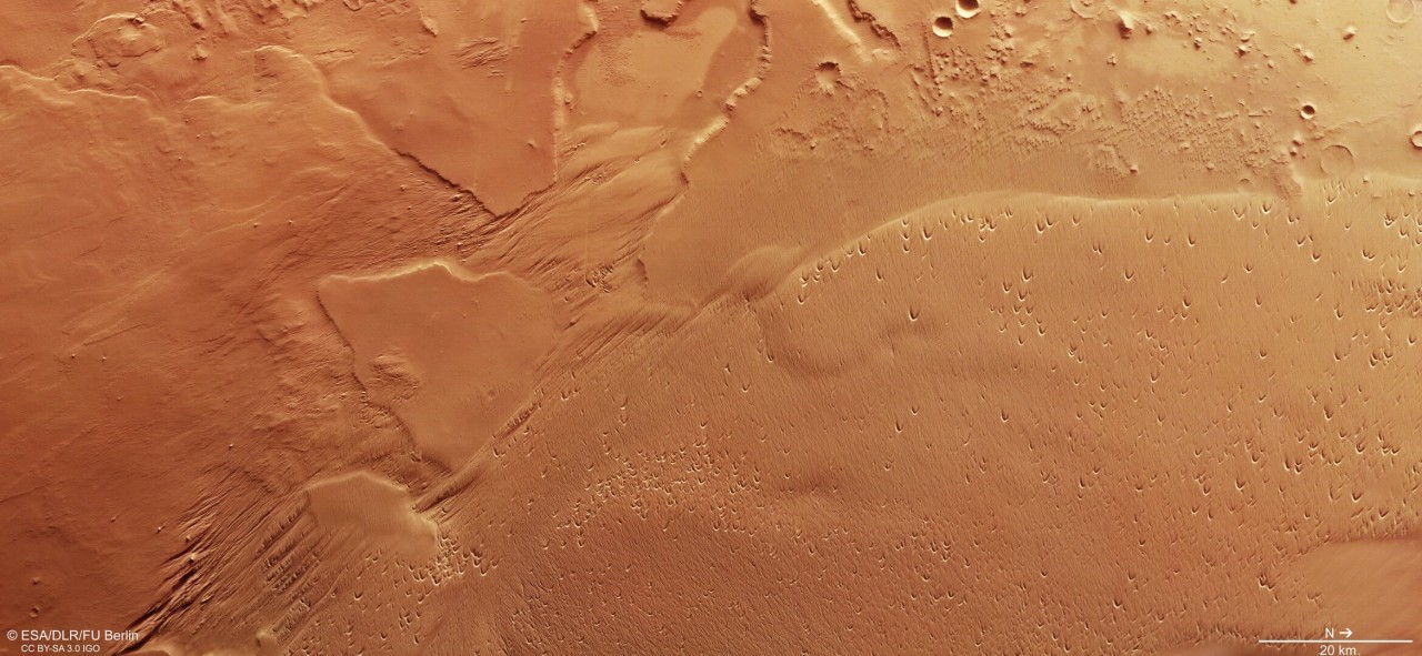 A giant Mars dust pile is sculpted by the wind in this photo by a European probe