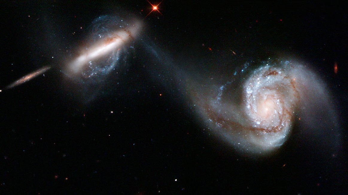 Galactic collisions act as a 'cosmic delivery service' for hungry monster black holes