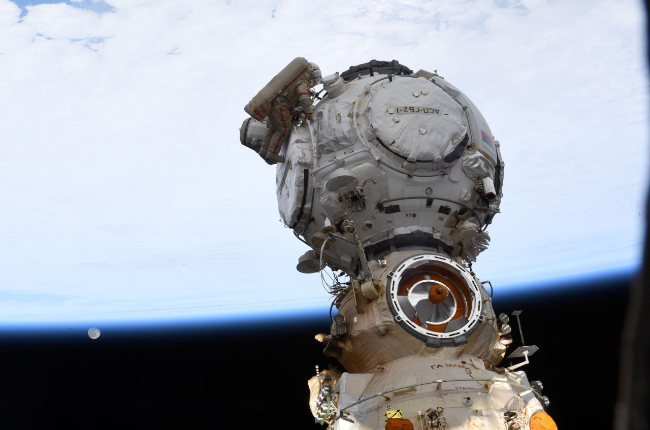 Cosmonauts on spacewalk ready new Russian docking port for future space station arrivals