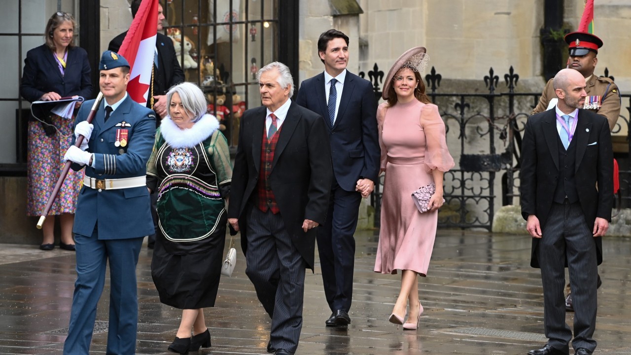 Artemis 2 astronaut Jeremy Hansen carries Canadian flag at coronation of King Charles