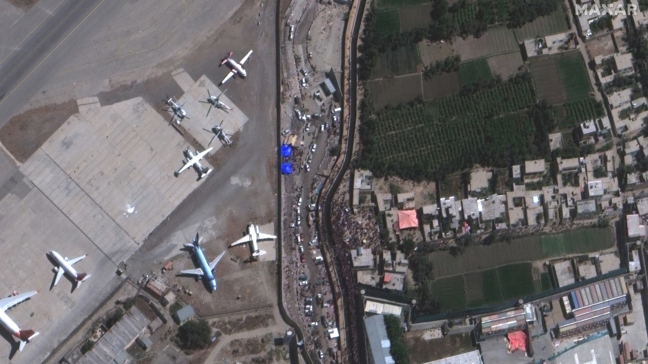 Satellite images show crowds at Kabul airport before two reported explosions