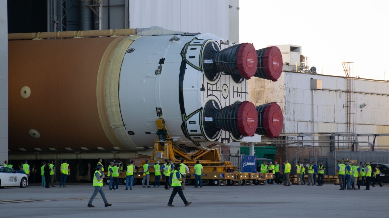 NASA rolls giant Artemis 2 moon rocket core off the factory floor for astronaut mission (video)