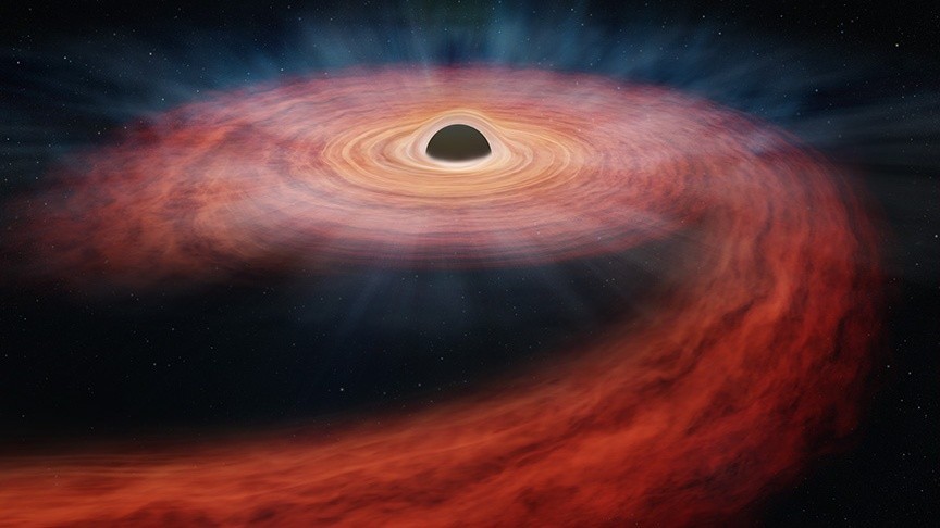 Supermassive black hole chews up huge star, spits stellar 'guts' into space (video)