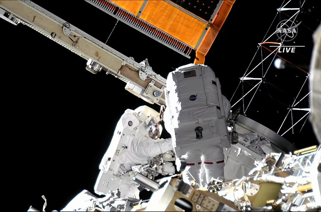 Spacewalking NASA astronauts erect support frame for new ISS solar array