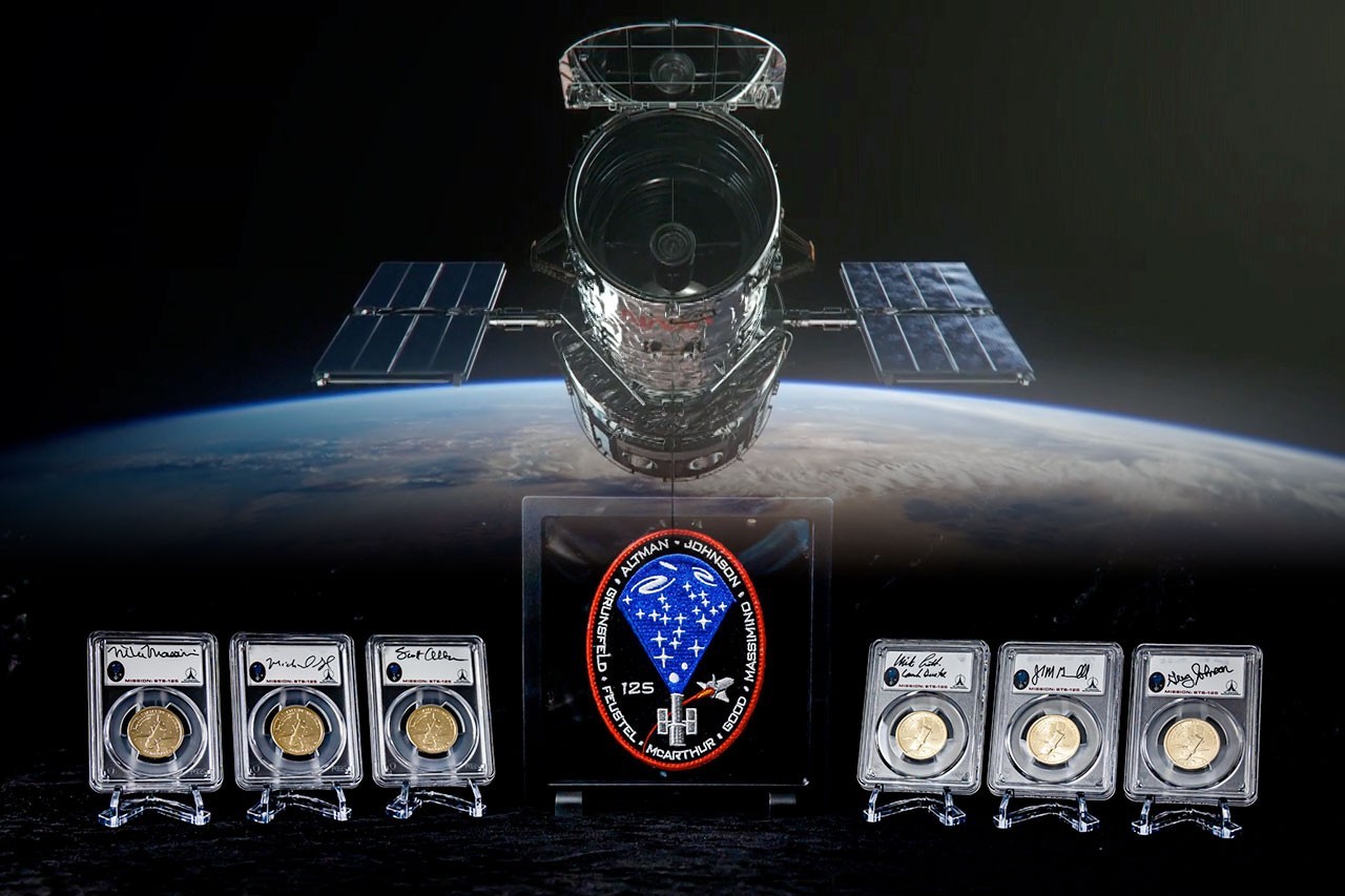 Last astronauts to visit Hubble Space Telescope sign coins for AMF fundraiser