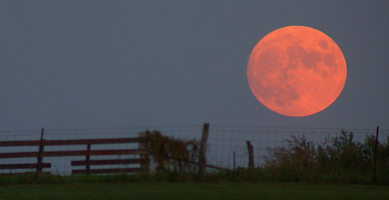 Why does the moon look close some nights and far away on other nights?