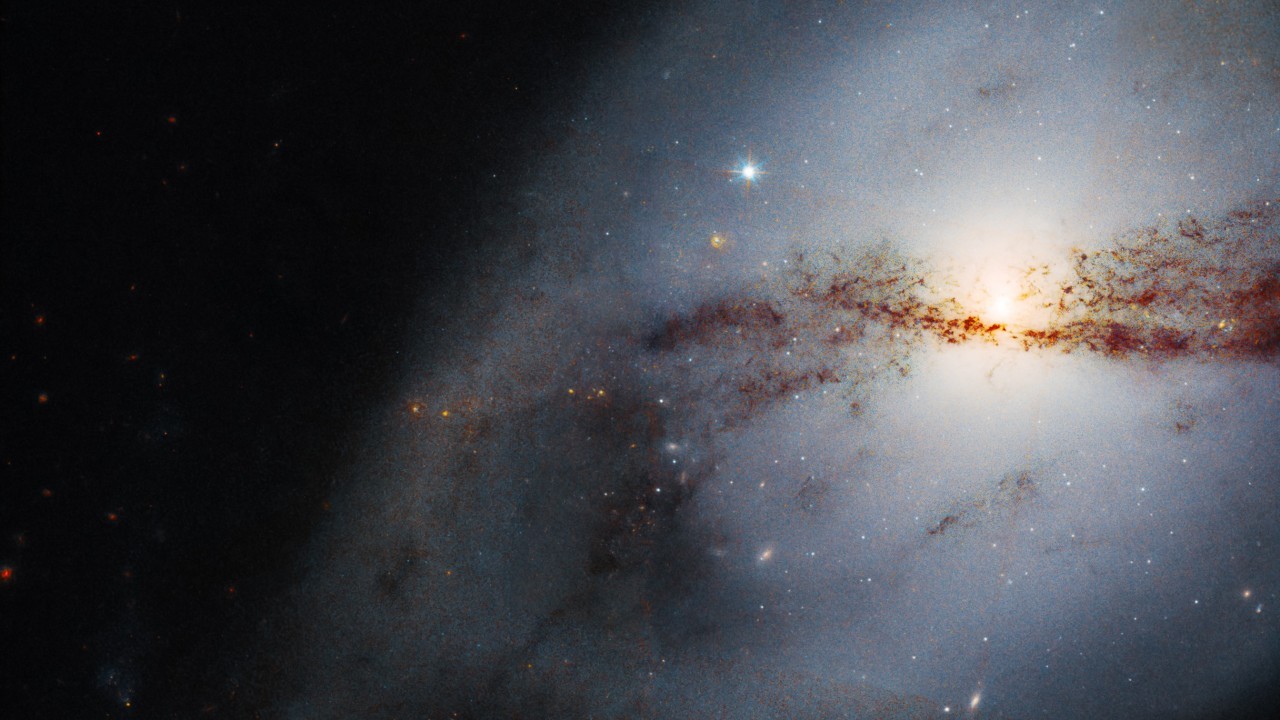 Hubble Space Telescope images twisted galaxy shaped by a big neighbor