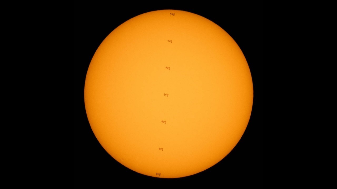 Wow! NASA photographer spots space station crossing the sun during spacewalk (video)