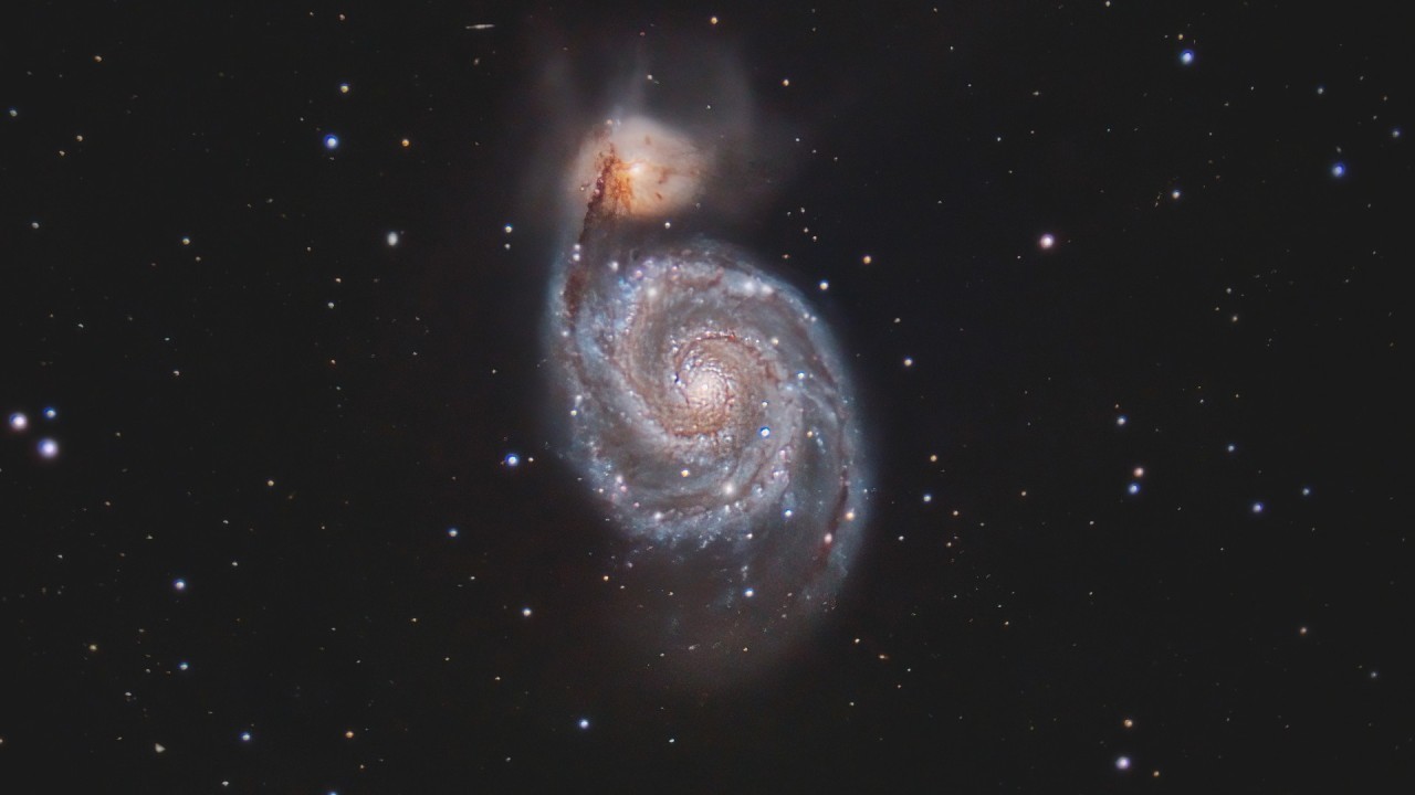 Gaze into the mesmerizing Whirlpool Galaxy high in the sky tonight